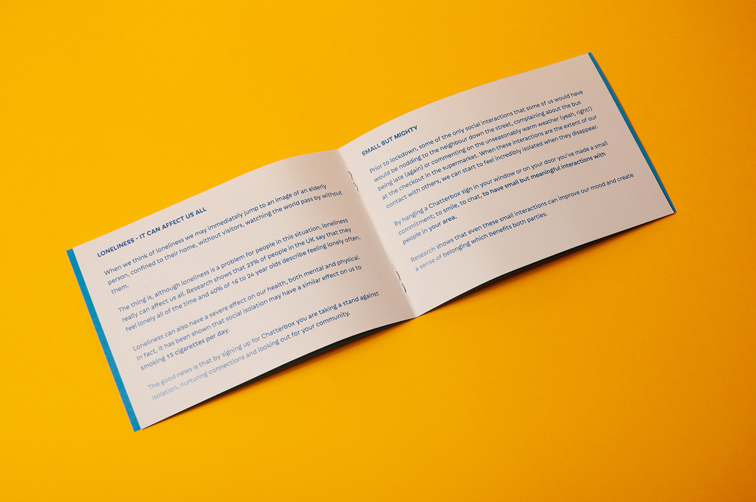 The inner spread of a small A6 booklet against a yellow background.