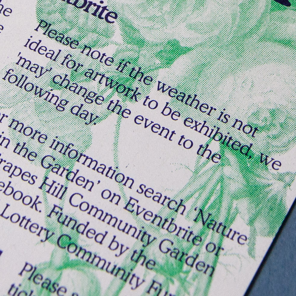 A close up photograph of a risograph printed flyer in green and purple showing text and illustrations of flowers