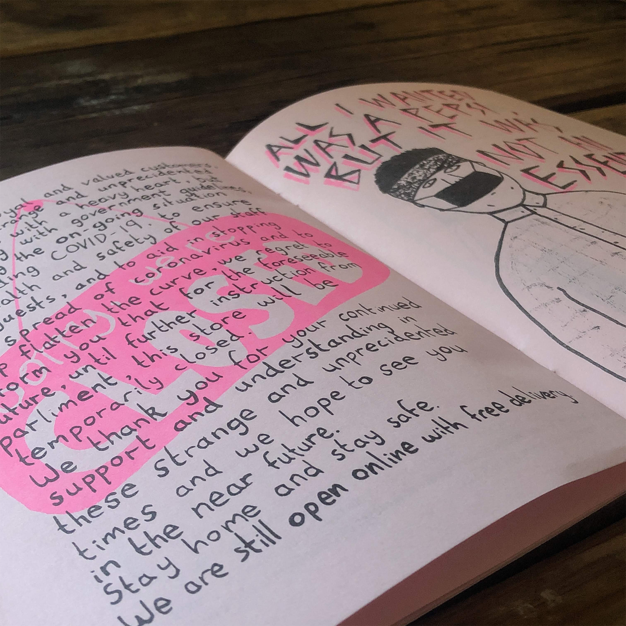 A close up photograph showing a risograph zine printed in pink and black